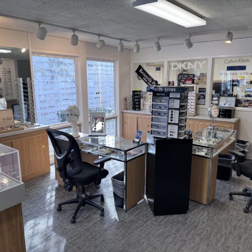 Designer eyewear display featuring Ray-Ban and Oakley frames in Skokie optical shop